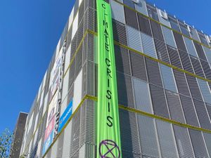 Supporting image for story: Climate campaigners in car park banner protest