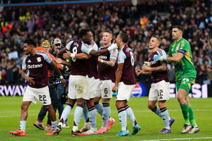 Aston Villa players celebrate after the full-time whistle