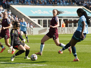 Manchester City's Khadija Shaw scores her side's first goal of the game during the Adobe Women's FA Cup quarter-final match against Aston Villa at The Joie Stadium, Manchester