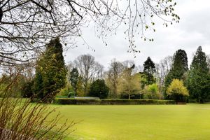 The club is situated behind the hedges seen here