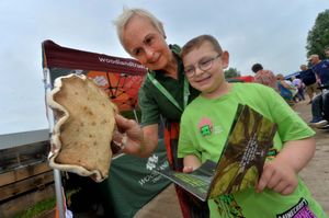 Oliver Collins, aged five, with Jane Glanville from the Woodland Trust and a large Fungai