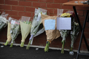Floral tributes left at the scene following the fatal stabbing, at West Road, Great Barr