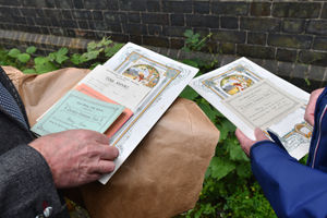 Wayne and Jean peruse memorabilia from the time Wayne's mother, Mary Owen, was at the school in the 1920s. Picture: Dave Bagnall.