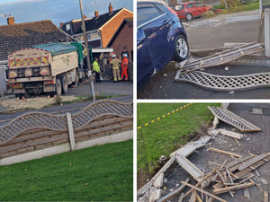Supporting image for story: Driver treated for shock after truck ploughs through fences and cars before smashing into bungalow in Brierley Hill