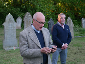 Reverend Paul Roberts led a prayer at the Commonwealth graves watched by veteran Brian MacKenzie.