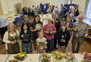 Hall competition winners - L-R - Back row - Caroline - Presidents Cup for her Cross stitch Sampler, Menna Thomas -11-16 yrs award, Jane Pugh - Cookery cup, Special cookery cup, and Horticulture - for Llanddewi resident, Behind - President Martin Udall, Sarah Brown - Floral Cup, Tony Lawrence – Horticulture. In the front row - Helen Jenkins - Woodwork Cup, Erin Powell - Art award, April Powell - 5-7 yrs award and new Junior President's cup - Jenni Thomas memorial cup for her Leaf insect collage and Danny Ingram - 10 - 11yrs award
