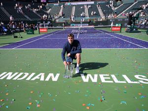 Jack Draper poses with the winner’s trophy at the BNP Paribas Open in Indian Wells