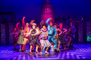 The cast of Hairspray on stage in Manchester.