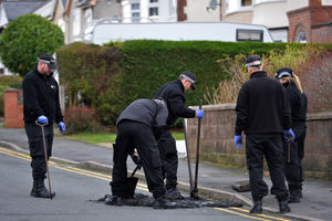 Police were conducting searches in the street