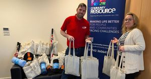 Dan Busby, Domestic Manager for NWF Fuels and Kelly Walker, Rural Services and Oil Buying Team Lead at Community Resource with the Warmer Winter packs