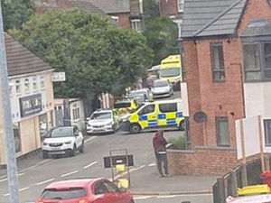 Police at the scene near Royal Balti in Charlton Street, Wellington. Photo: Abi Gardner