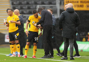 Bruno Lage, Manager of Wolverhampton Wanderers speaks with Joao Moutinho of Wolverhampton Wanderers. (Photo by Jack Thomas - WWFC/Wolves via Getty Images).