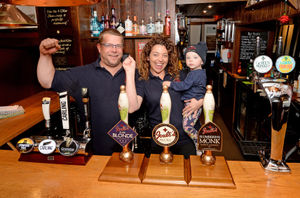 Michael and Sherrie Darch-Williams from the Kings Arms in Church Stretton celebrate reopening with one-year-old daughter Dottie