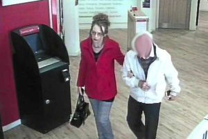 Robinson at a bank with the pensioner, who served in the North Atlantic during the Second World War