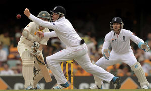Australia's Chris Rogers (left) hits a shot past England's Ian Bell (centre)
as Matt Prior (right) looks-on