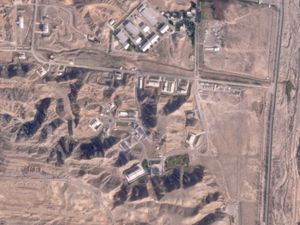 Supporting image for story: Satellite images show damage from air strikes at two Iranian military sites