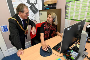 Dr Hardacre chats with help line manager Kulvinder Kaur