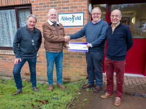 Nick Smart, chairman of the Purslow committee, shaking hands with Bob Berry, chairman of BC Abbeyfield, with Purslow committee members Alastair Edie and Richard Webb