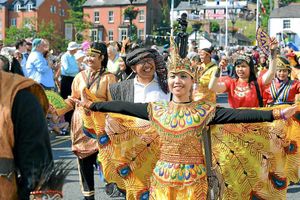 The colourful procession entertains crowds