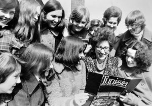 April 4, 1975: 'Ready for their school trip to North Africa, party leader Mrs Elaine Beamond studies a brochure with pupils of Charlton School, Dothill, Wellington, before leaving for Tunisia yesterday. The party will be staying in Sousse for eight days. Headmistress Mrs H.M. Rafferty, and head of upper school Mr N.P. Howson also accompany the group.'