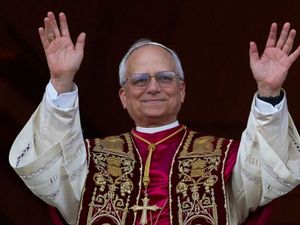 The new Pope waves at the Vatican