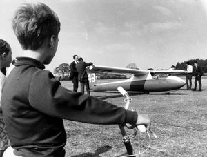 A glider comes down in the playing field at Abraham Darby School, Madeley, June 5, 1970. 'This is the sort of thing you remember from your school days. On June 4, 1970, a glider landed safely in the school field at the Abraham Darby School, Madeley. The pilot was Mr David Millett, chief instructor at Worcester Gliding Club, who was taking part in a competition, but simply ran out of lift and had to find somewhere to put down. Youngsters are watching the dismantling of the undamaged glider ready to be trailered away. Conditions must have been tricky that day, because around the same time a glider landed on Lilleshall Cricket Club's ground.'