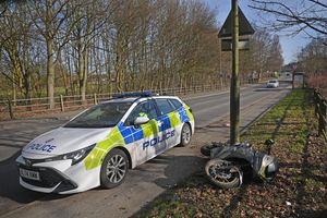 A police car on Sneyd Lane on Monday morning
