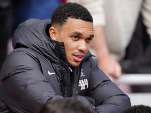 Trent Alexander-Arnold watches on from the stands