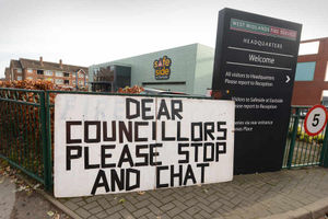 Firefighters demonstrate outside West Midlands Fire Service headquarters in Birmingham