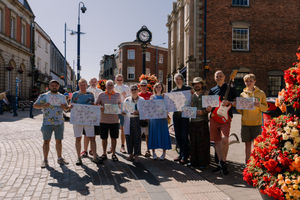 locals gather to hand out the first copies of the Stourbridge Music Map 
