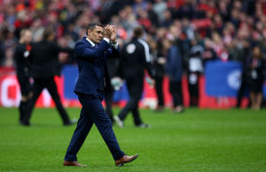 Manager Paul Hurst applauds the travelling blue and amber army after full time