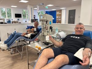 Paul Cadman, right, donating plasma with his friend Phil Upton, left, at the NHS donor centre in Birmingham.