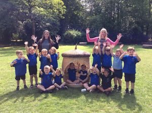 Sheriffhales Primary School and Preschool pupils and staff celebrating its Ofsted report.