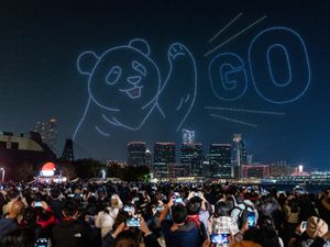 Supporting image for story: Crowds gather to watch spectacular drone show marking arrival of giant pandas