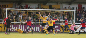 Players of Leamington claim for a late penalty as it appears the ball was handled by Neill Byrne of AFC Telford United