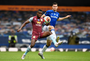 Everton's Michael Keane (right) and Aston Villa's Mbwana Samatta (left)