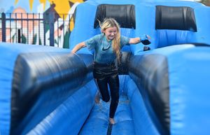 The rain didn't stop the smiles. Pictured is Taylor Robins, 11, on the bunjee run