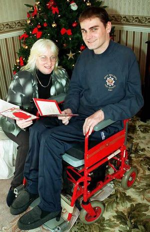 Andy at his parents' home with mum Patricia, shortly after the accident