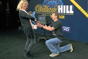 Chris Buxton proposes to Janine Ward on stage before the start of the darts final in Wolverhampton – and she said yes