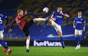 Manchester United's Donny van de Beek (left) and Brighton and Hove Albion's Pascal Gross