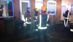 Firefighters at the scene of the house fire @hadencrossfire