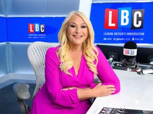 Vanessa Feltz sits and smiles in an LBC radio studio