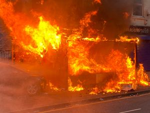 Supporting image for story: Shop front destroyed in fire as crews stop blaze from spreading to neighbouring homes