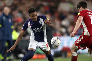 Grady Diangana of West Bromwich Albion and Paddy McNair of Middlesbrough  during the Sky Bet Championship match between Middlesbrough and West Bromwich Albion at Riverside Stadium on February 22, 2022 in Middlesbrough, England. (Photo by Adam Fradgley/West Bromwich Albion FC via Getty Images).