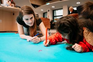 Activities to mark the Big Garden Birdwatch. Taking place here at Shropshire Hills Discovery Centre in Craven Arms. In Picture: Ellie Colver from British Dragonflies Society helping Leela Kapoor, 3, with drawing a dragonfly