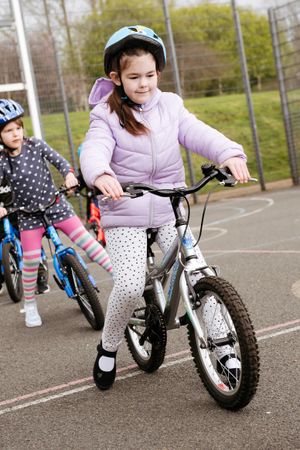Youngsters taking part in a children's cycling training session with Instructor Nick Jenko.