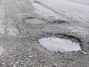 Supporting image for story: Watch out for Shropshire B road potholes hidden after heavy rain, warn police