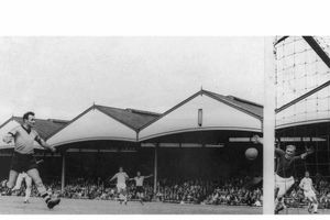 Jimmy Murray scores Wolves second goal against Manchester City at Molineux, with the old Waterloo Road stand as the backdrop.