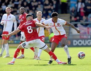 Liam Gordon battles for the ball.