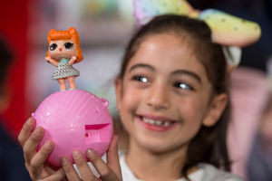 Natasa Neocleous, 7, plays with the LOL Surprise Series 2 during the unveiling of the annual DreamToys list compiled by an independent panel of retailers which predicts the top Christmas toys on show at St Mary's Church, in Marylebone, London